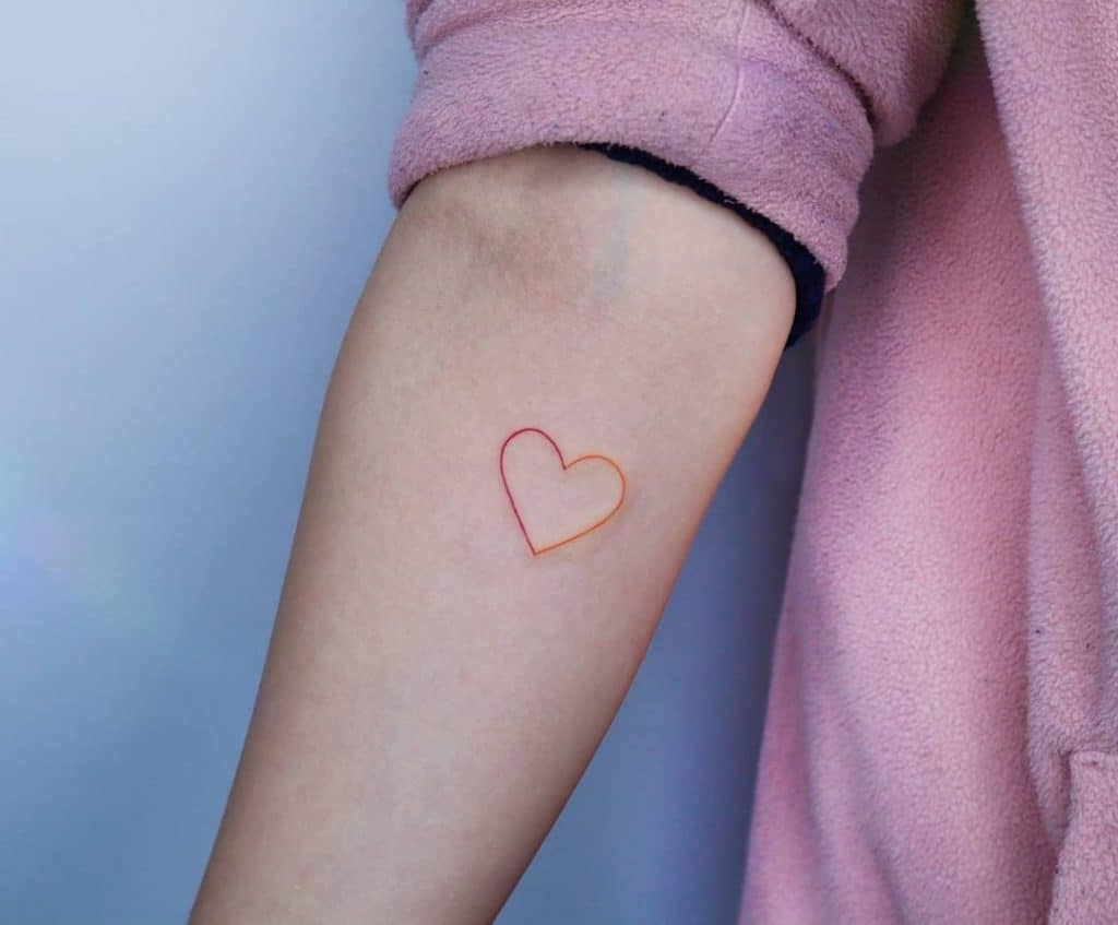 Heart Shaped Small Tattoo Over Forearm