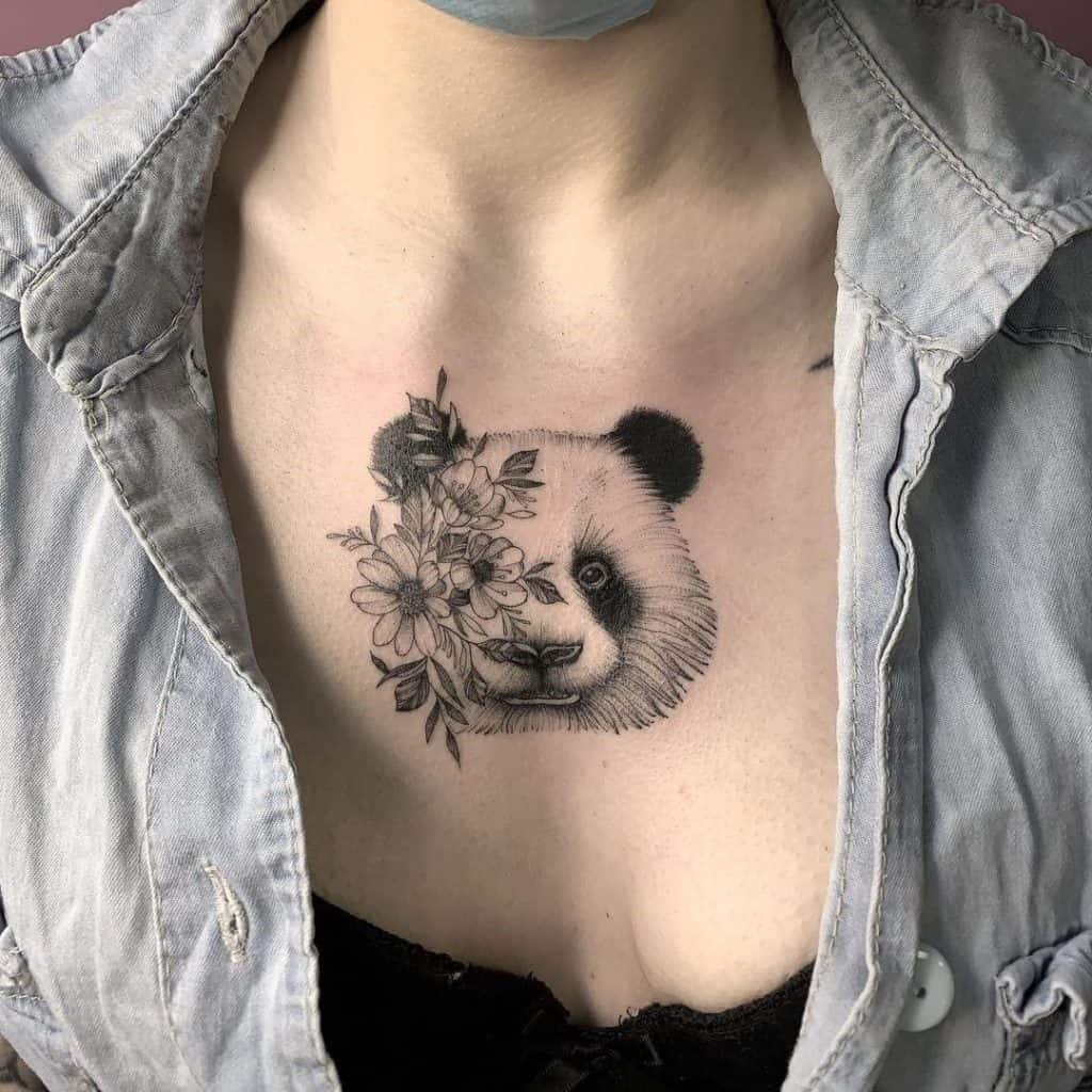 Panda Baby Tattoo On Chest With Flowers 