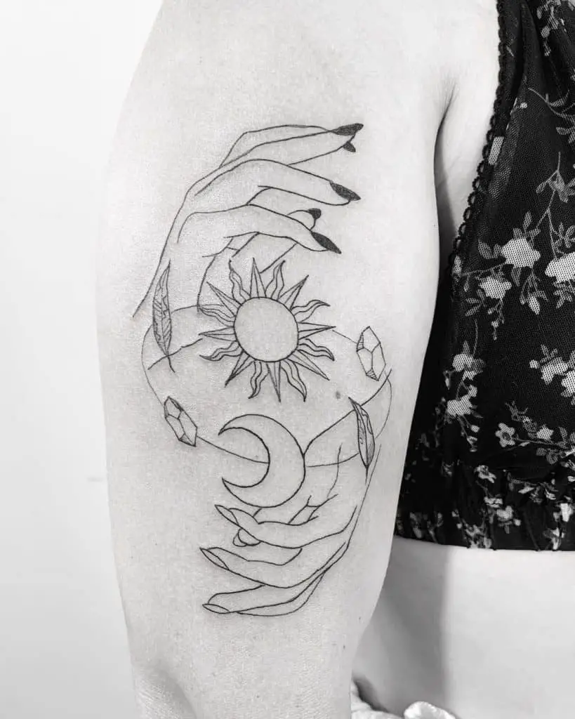 The Sun and Moon Held By Hands Tattoo Design