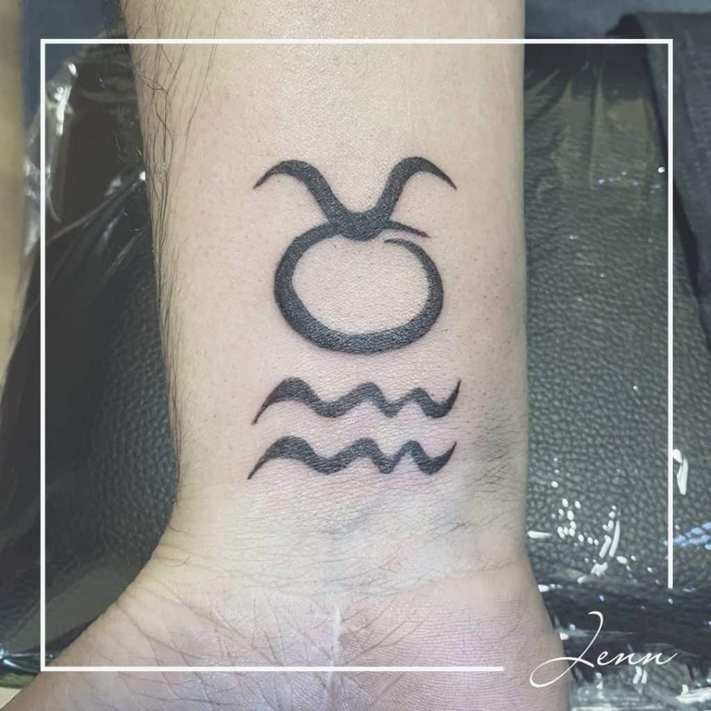 Aquarius Tattoo on wrists 1