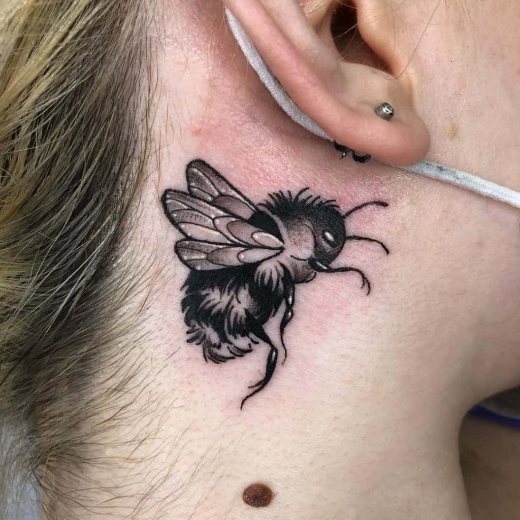 Bee Black Ink Behind Ear Tattoo 