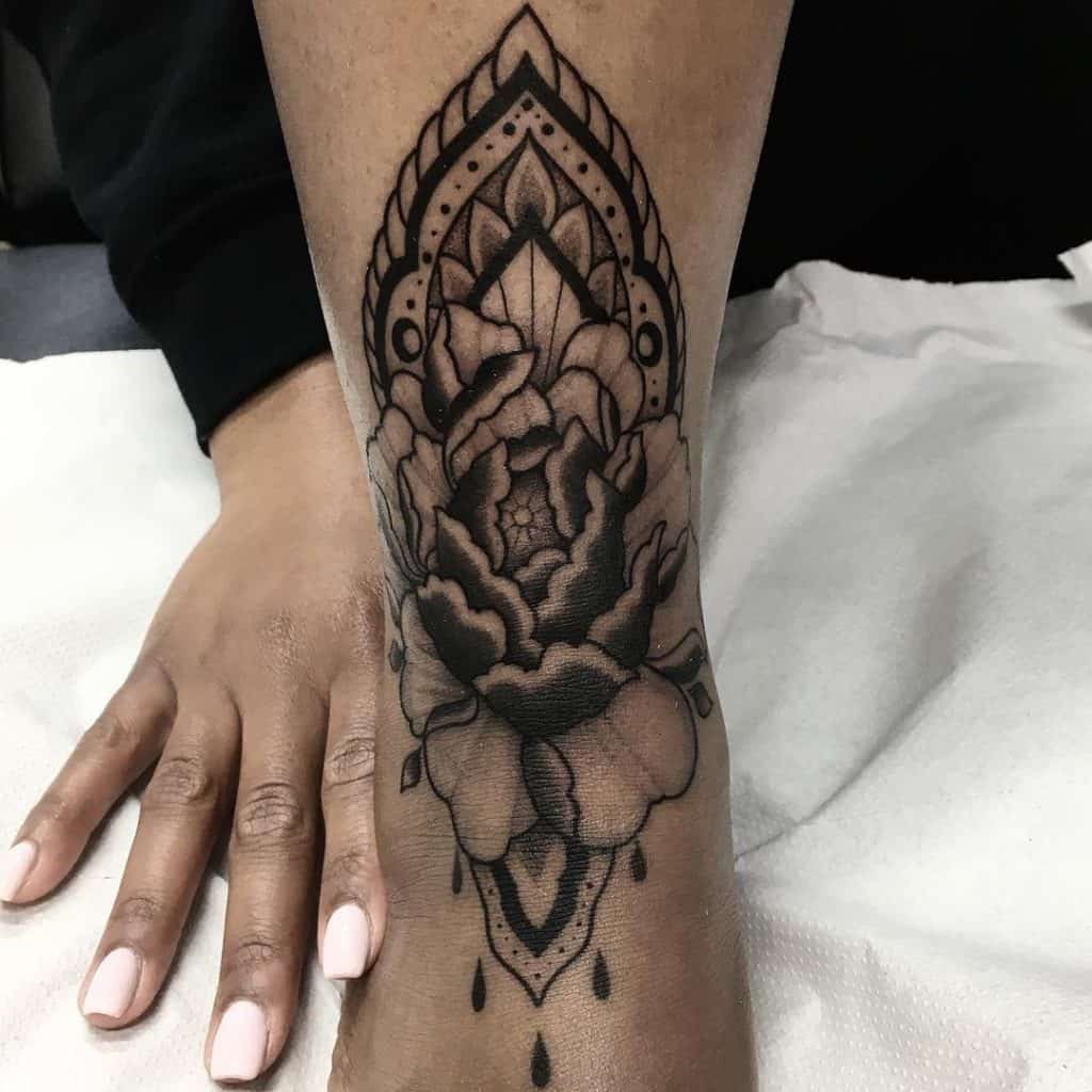 Black & Precise Mandala Foot Tattoo Ideas 