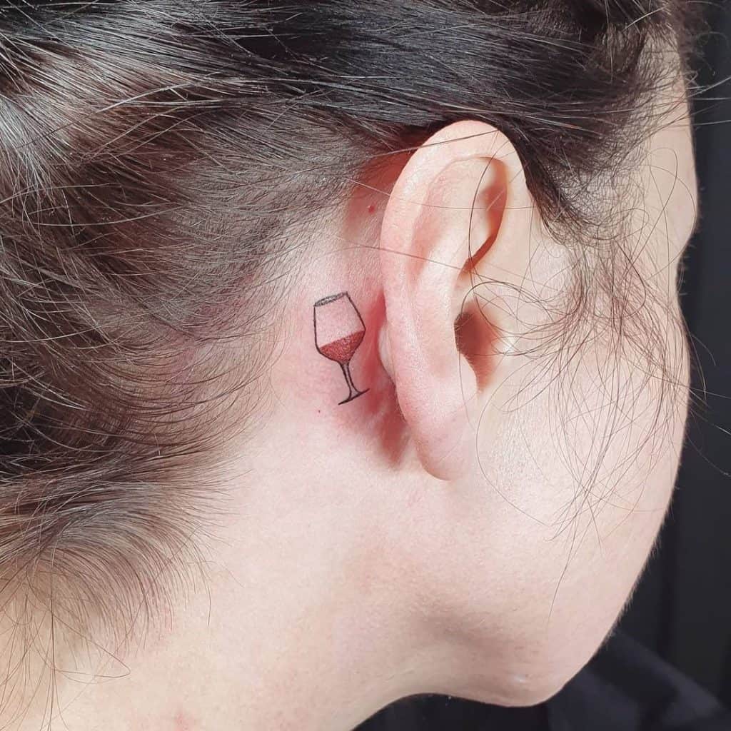 Small Wine Inspired Behind Ear Tattoo