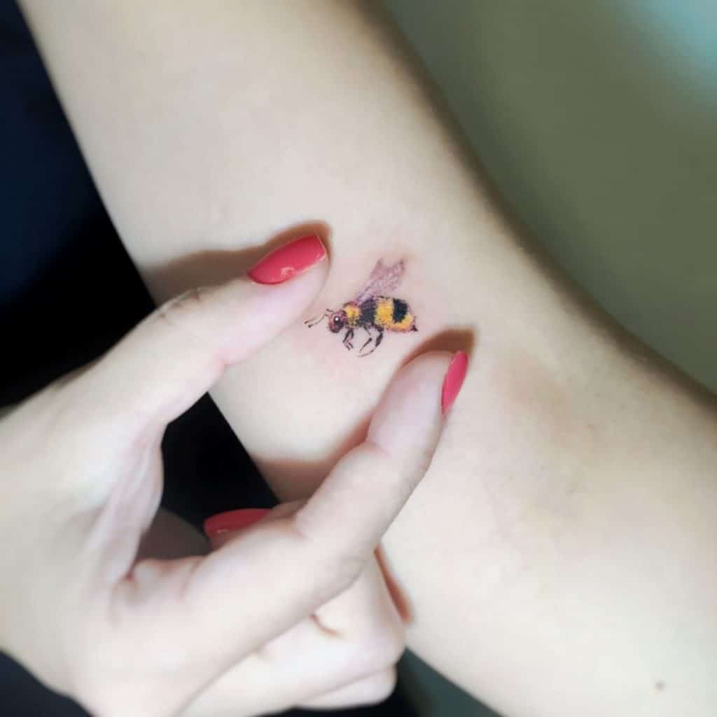 Tiny bee tattoo 2