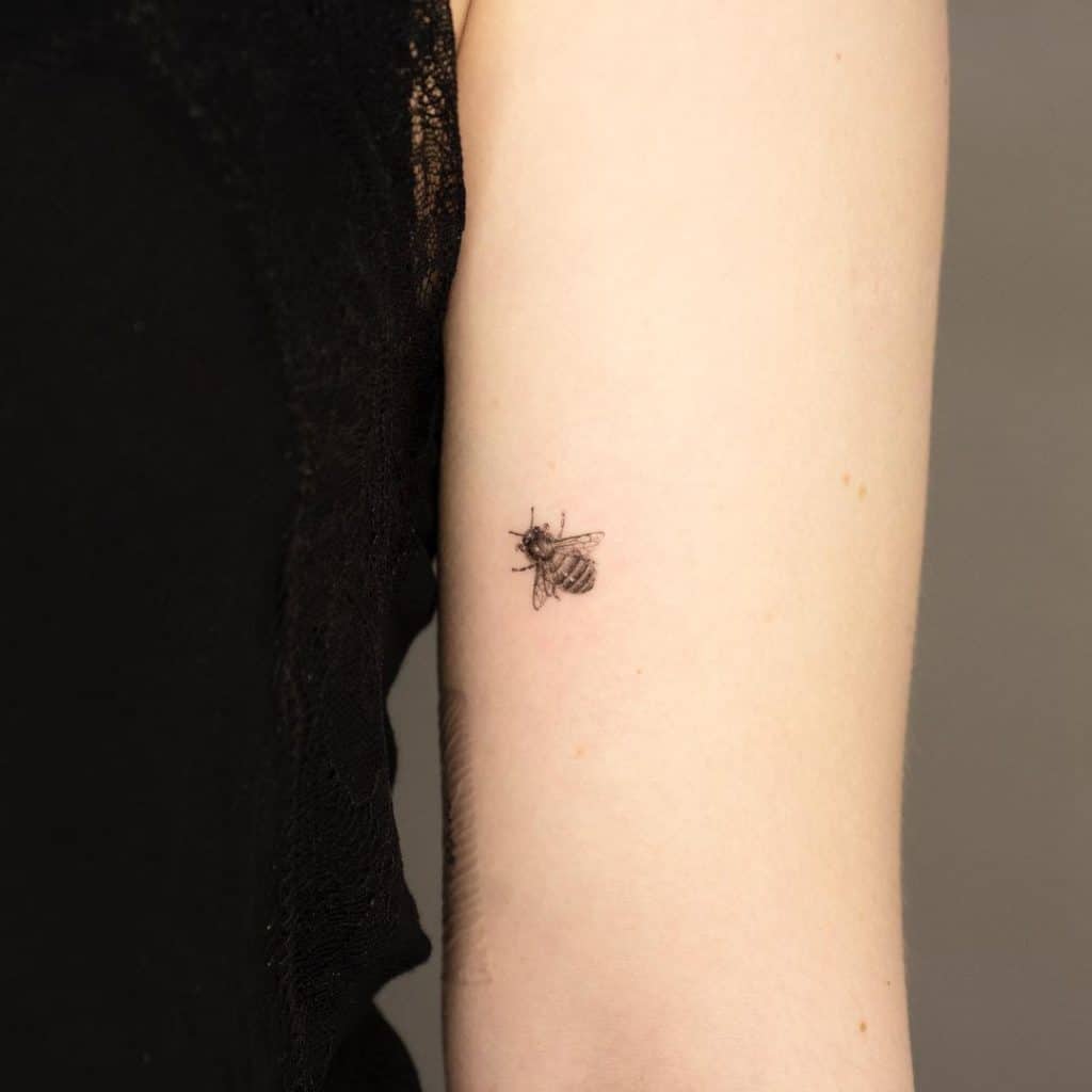 Tiny bee tattoo 4