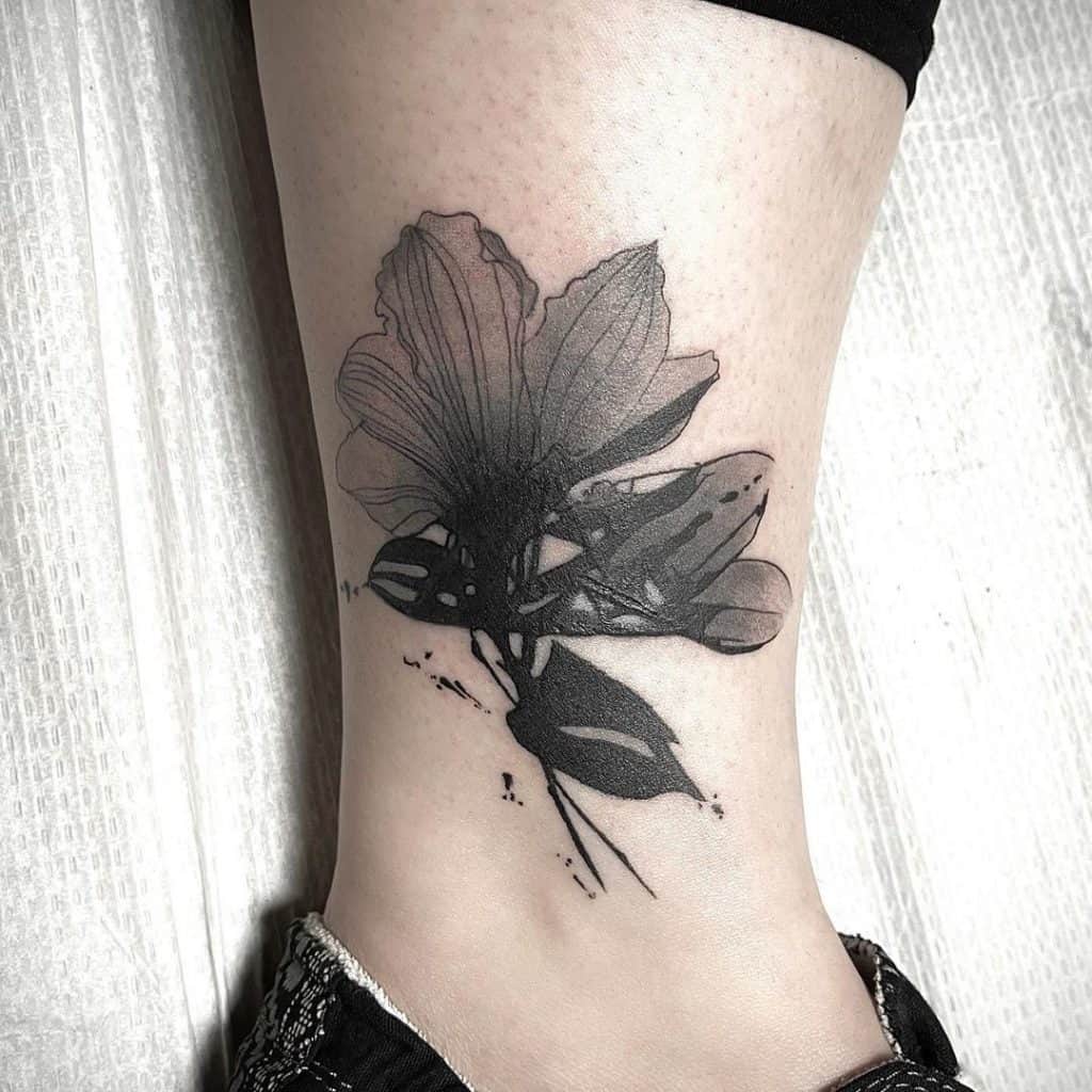Black Flower Tattoo on lower leg
