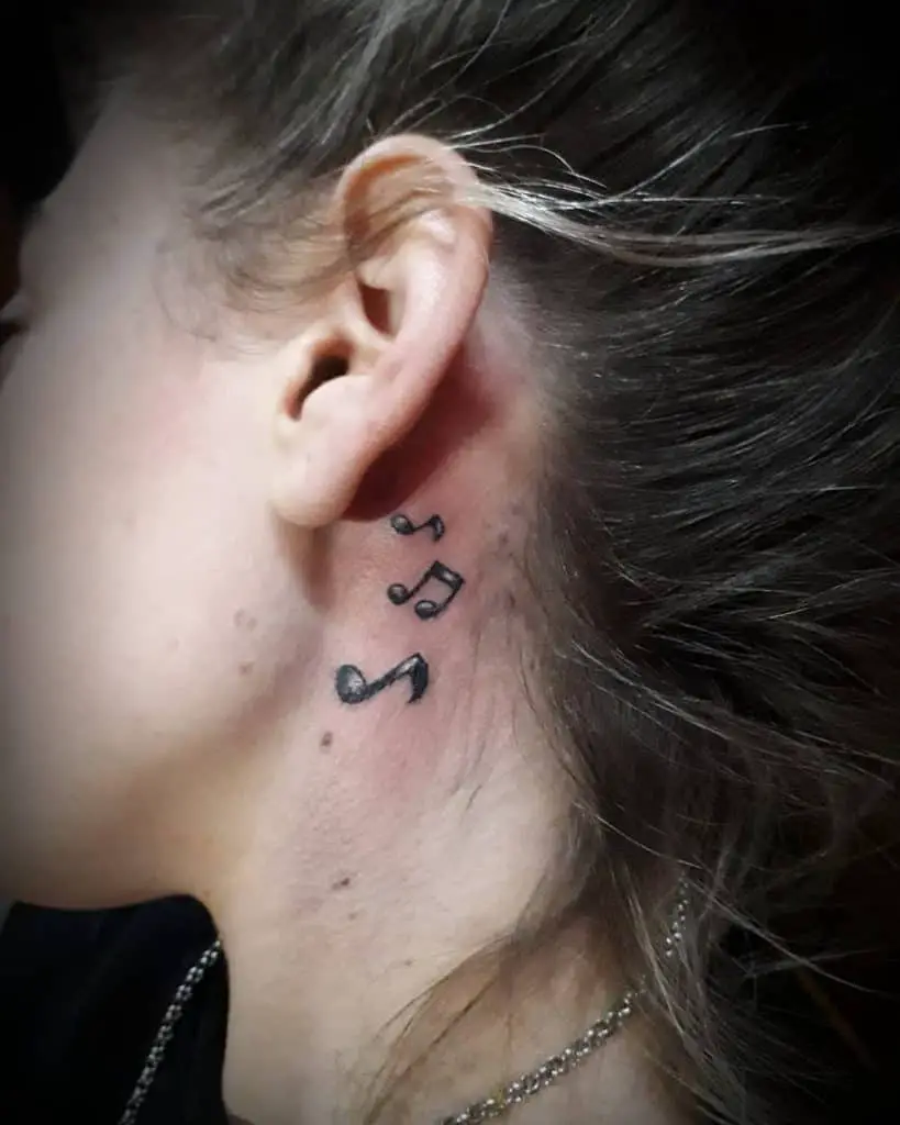 Music notes neck tattoo 1