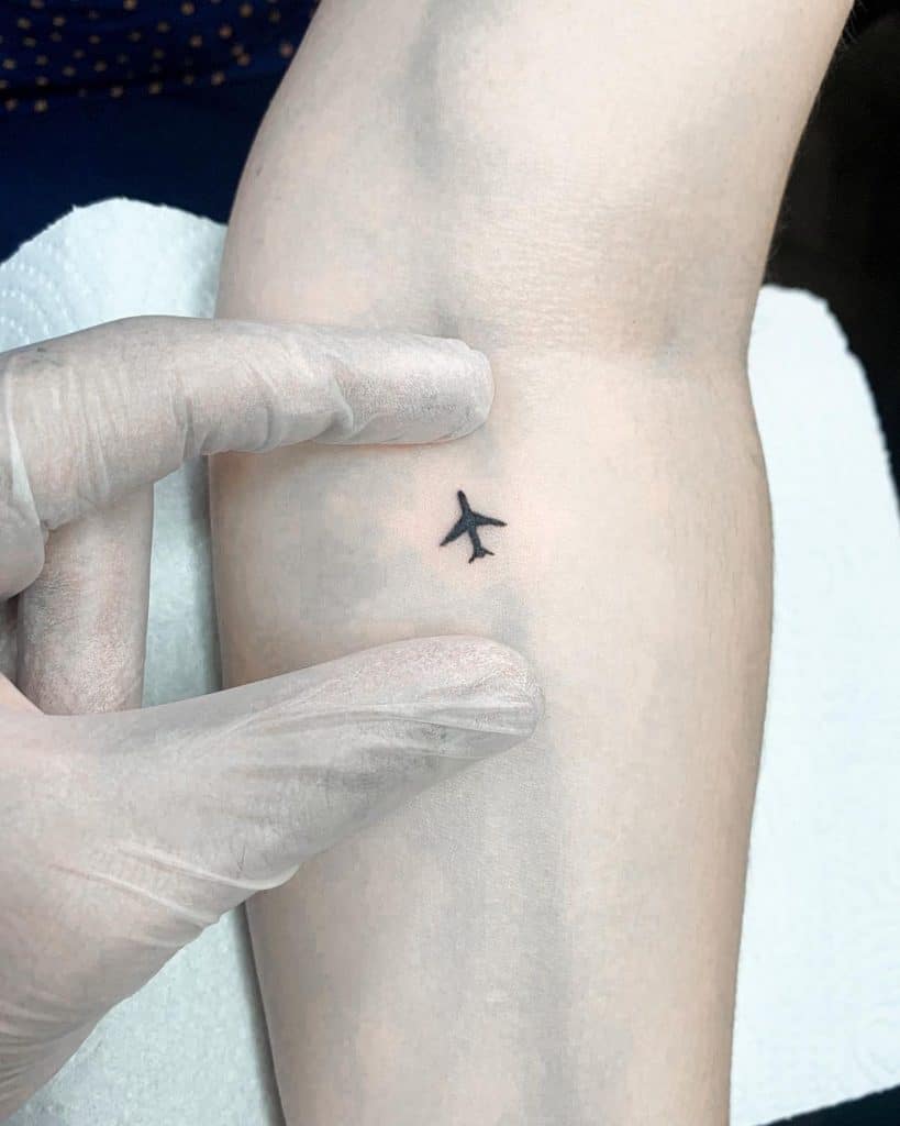 Small & Delicate Airplane Tattoo