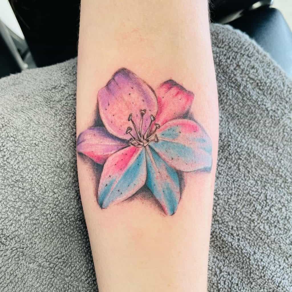 Colorful Lily Tattoo Idea Over Arm