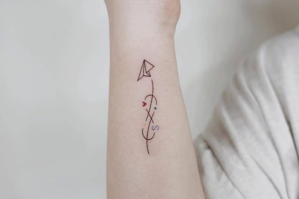 Paper airplane tattoo with big meanings 2