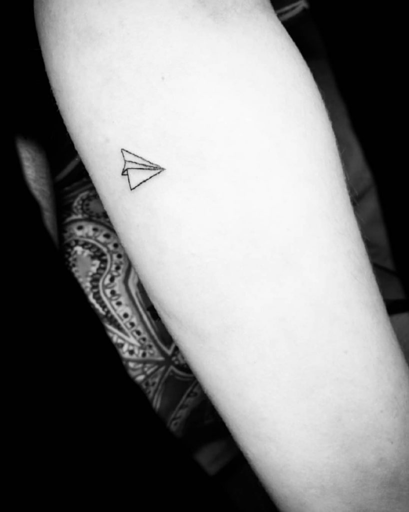 Paper airplane tattoo with big meanings 4