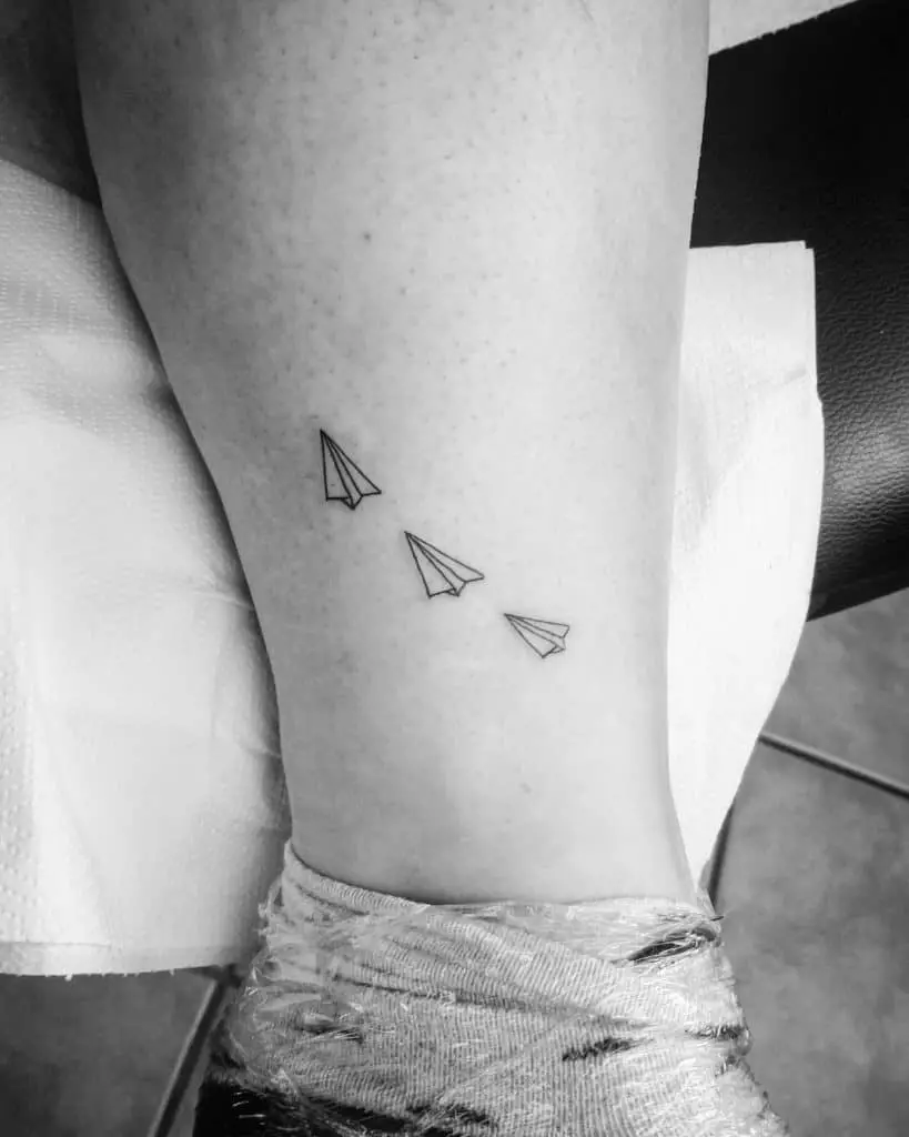 Paper airplane tattoo with big meanings 5