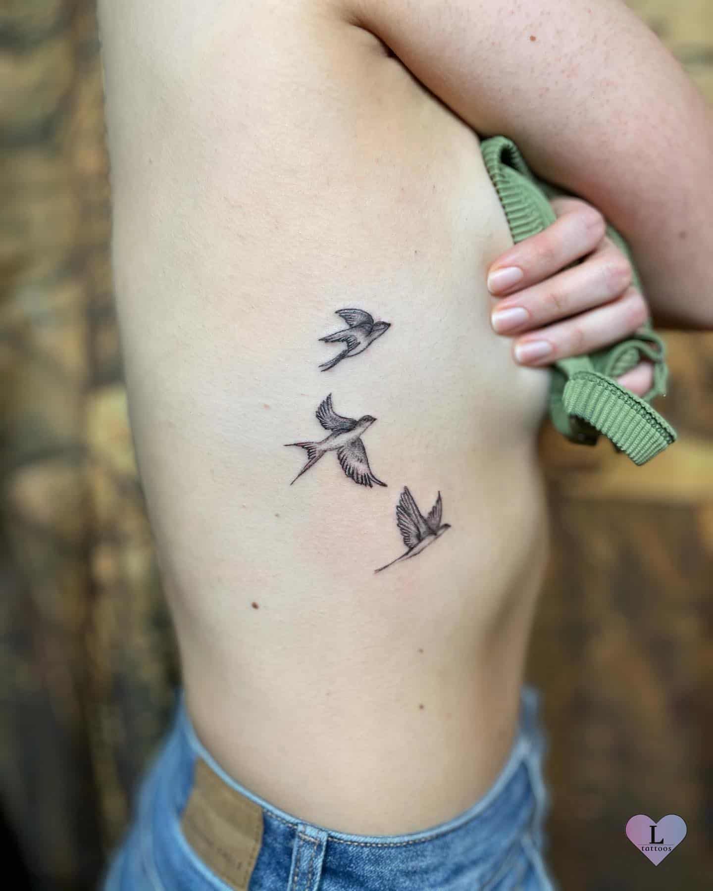 Bird side tattoo 1