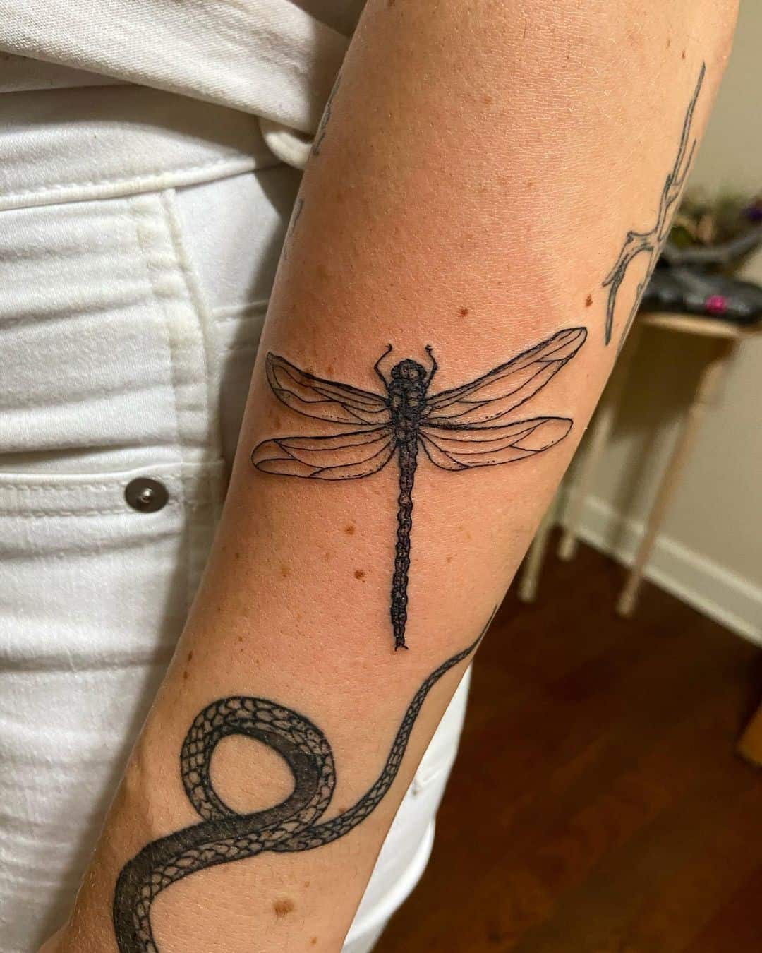 Black Tiny Dragonfly Tattoo