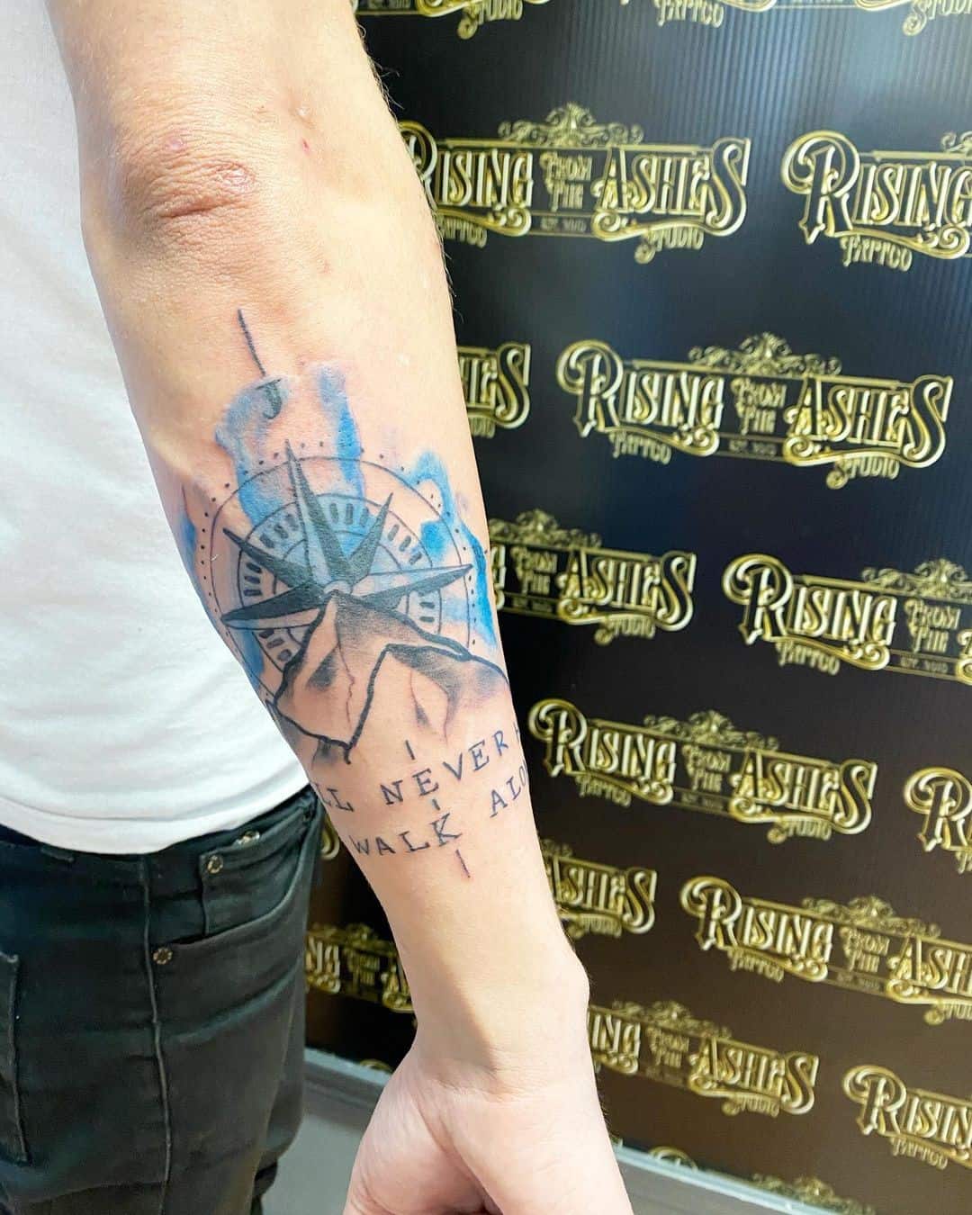 Blue Compass Tattoo Over Forearm Design