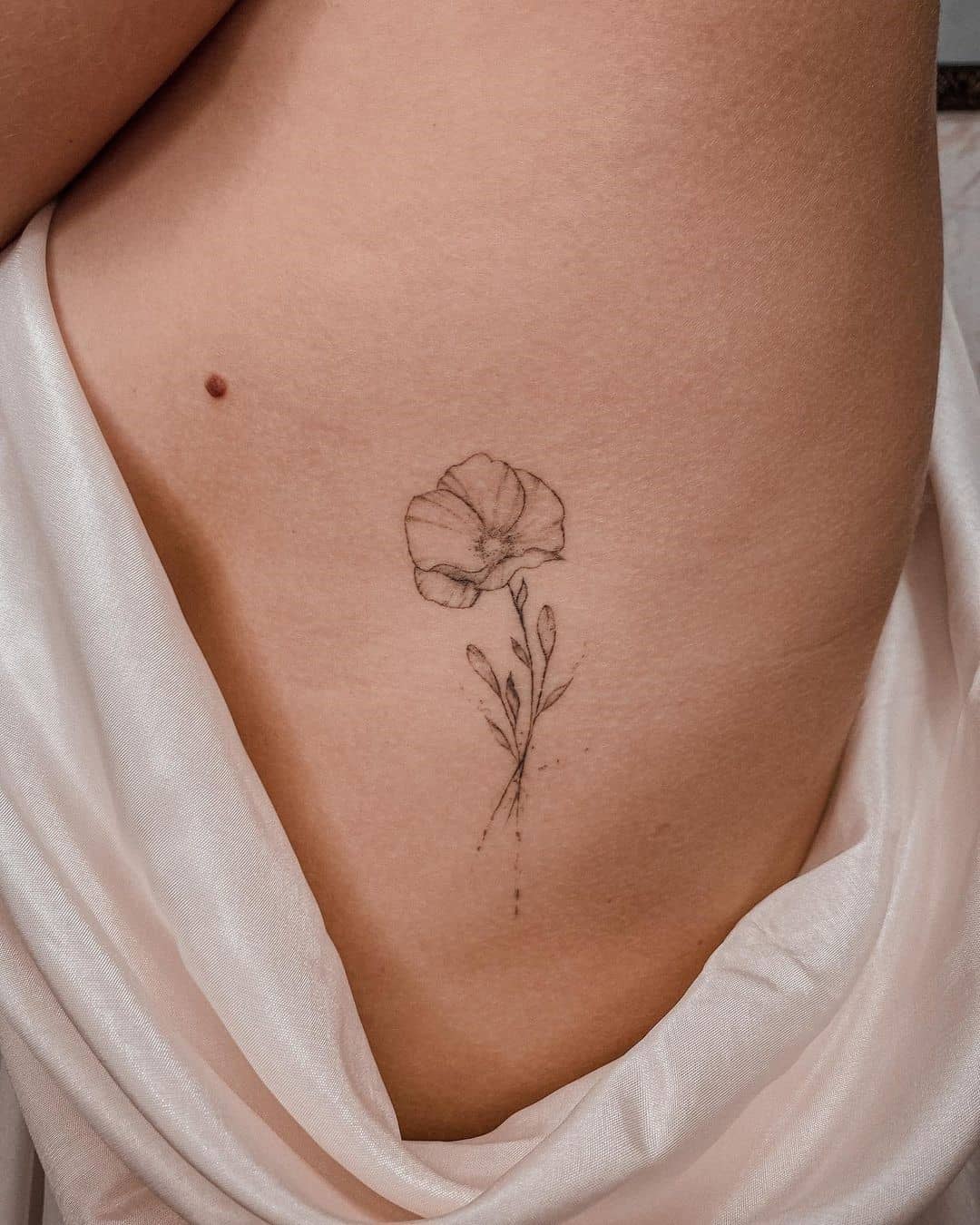 Feminine Tiny Poppy Flower Tattoo