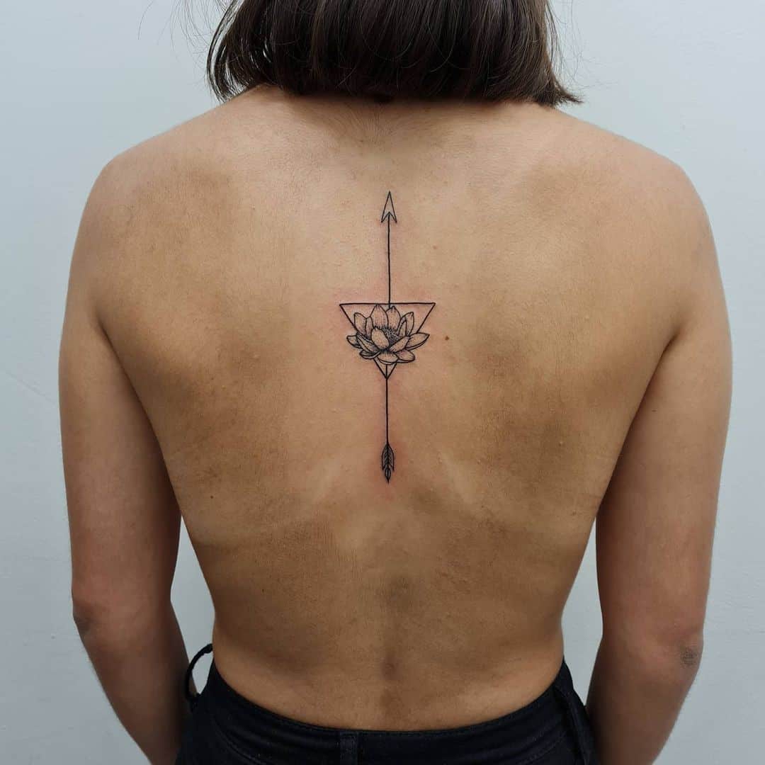 Giant Back Arrow Tattoo With Flower Idea