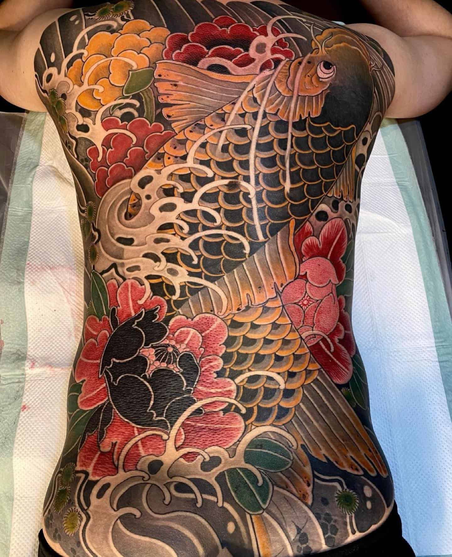 Japanese flower tattoo on back 1