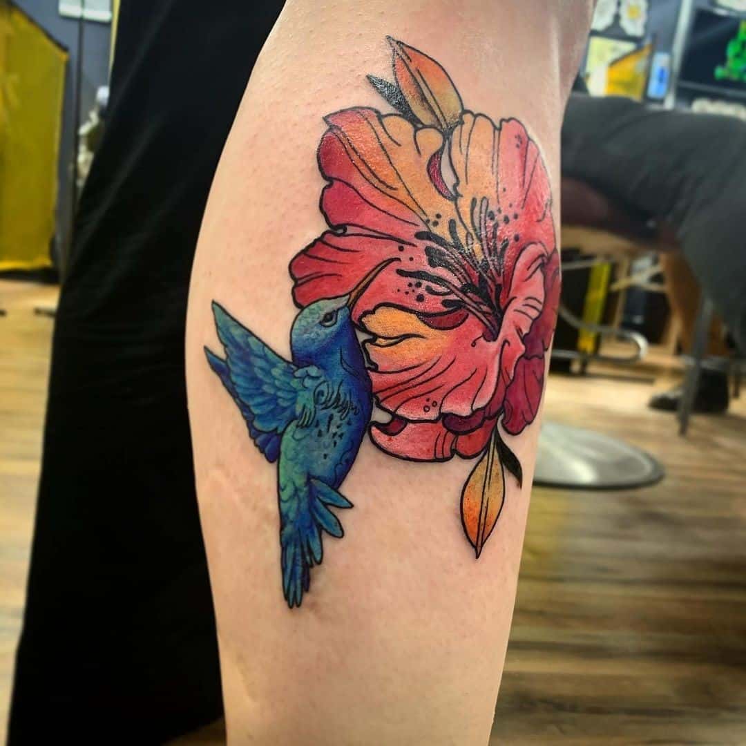 Pink Hibiscus Flower Tattoo With A Bird Idea