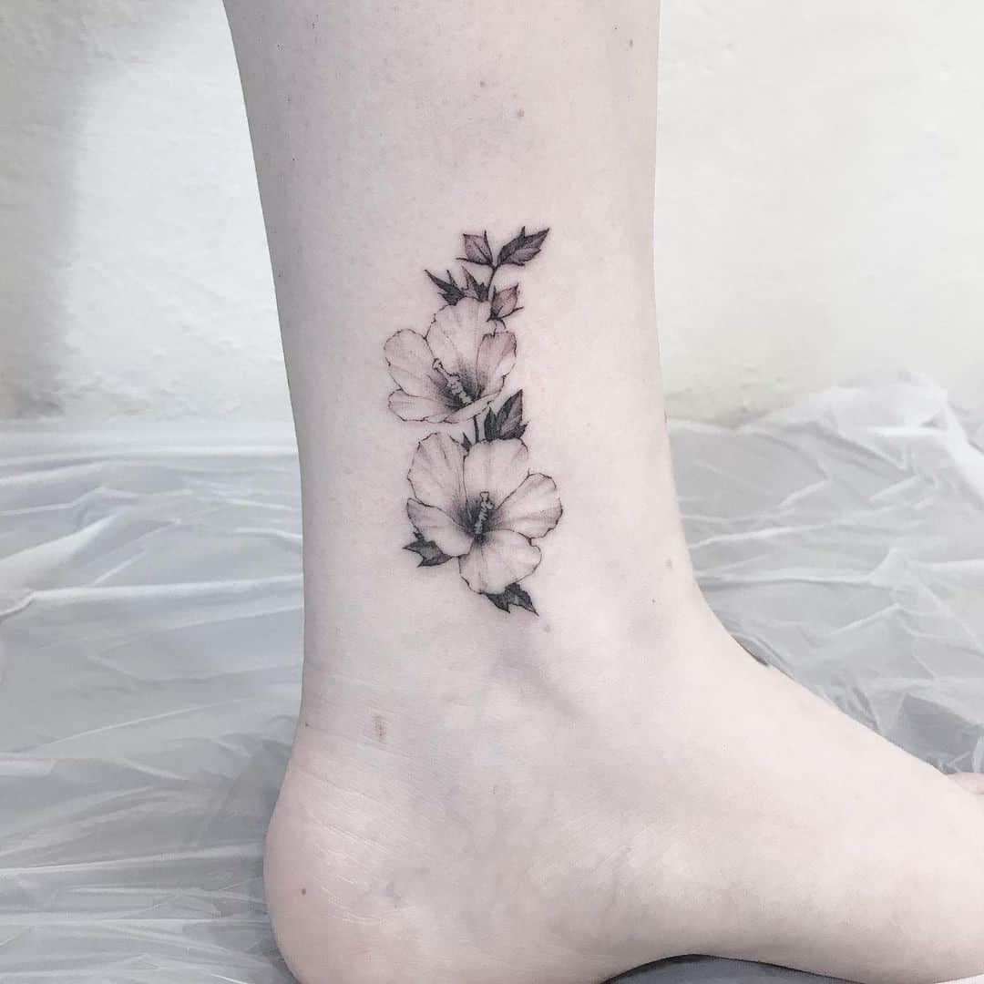 Small & Cute Hibiscus Flower Foot Tattoo