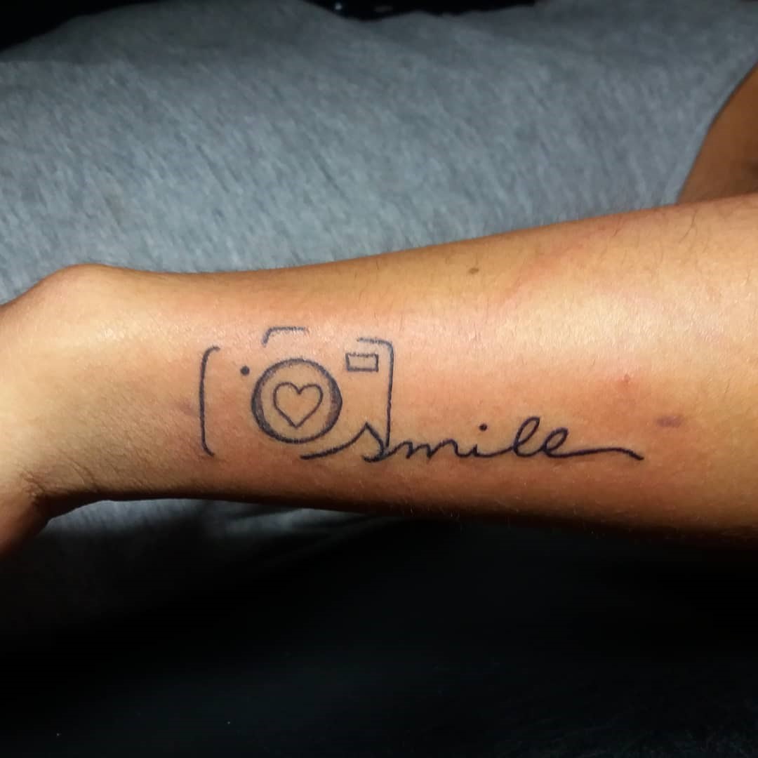 Optimistic Smile Tattoo Arm Ink 