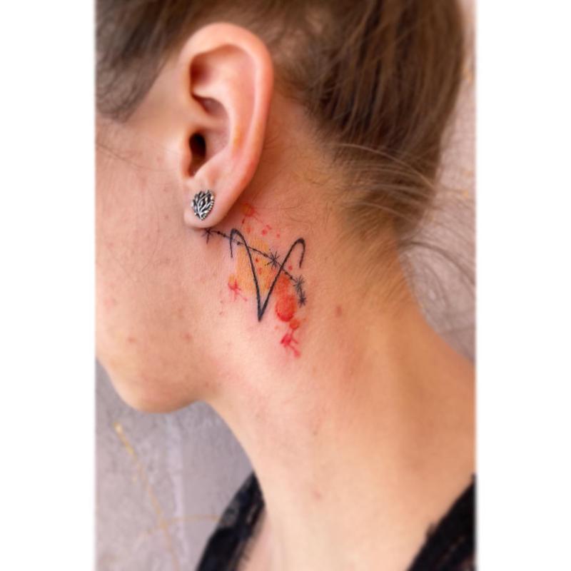 Behind the ear Aries tattoo 2