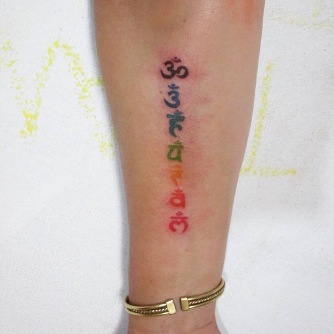 Colorful Small Chakra Tattoo 