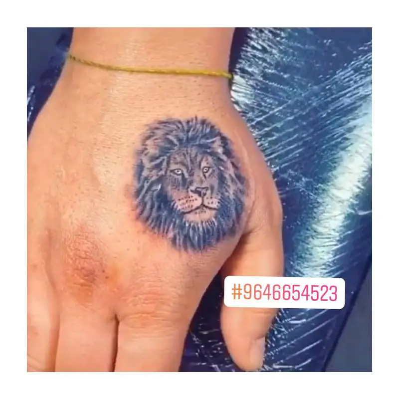 Tiny, Minimal Lion Tattoo 1