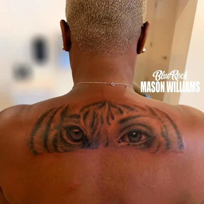 Half Tiger Half-Human Eyes Back Tattoo Design
