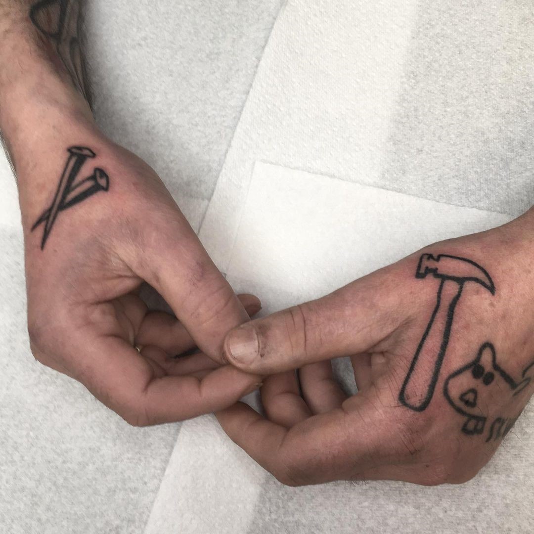 Hammer And Nail Tattoo 