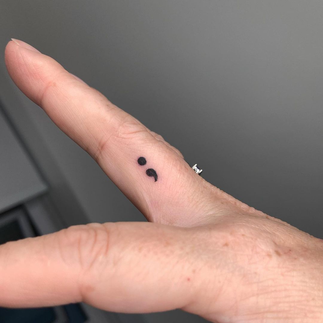 Semicolon Tattoo on finger