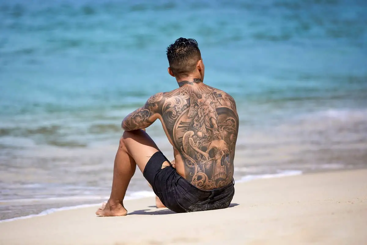 Can I Tan After Getting a Tattoo? How Long to Wait - Saved Tattoo